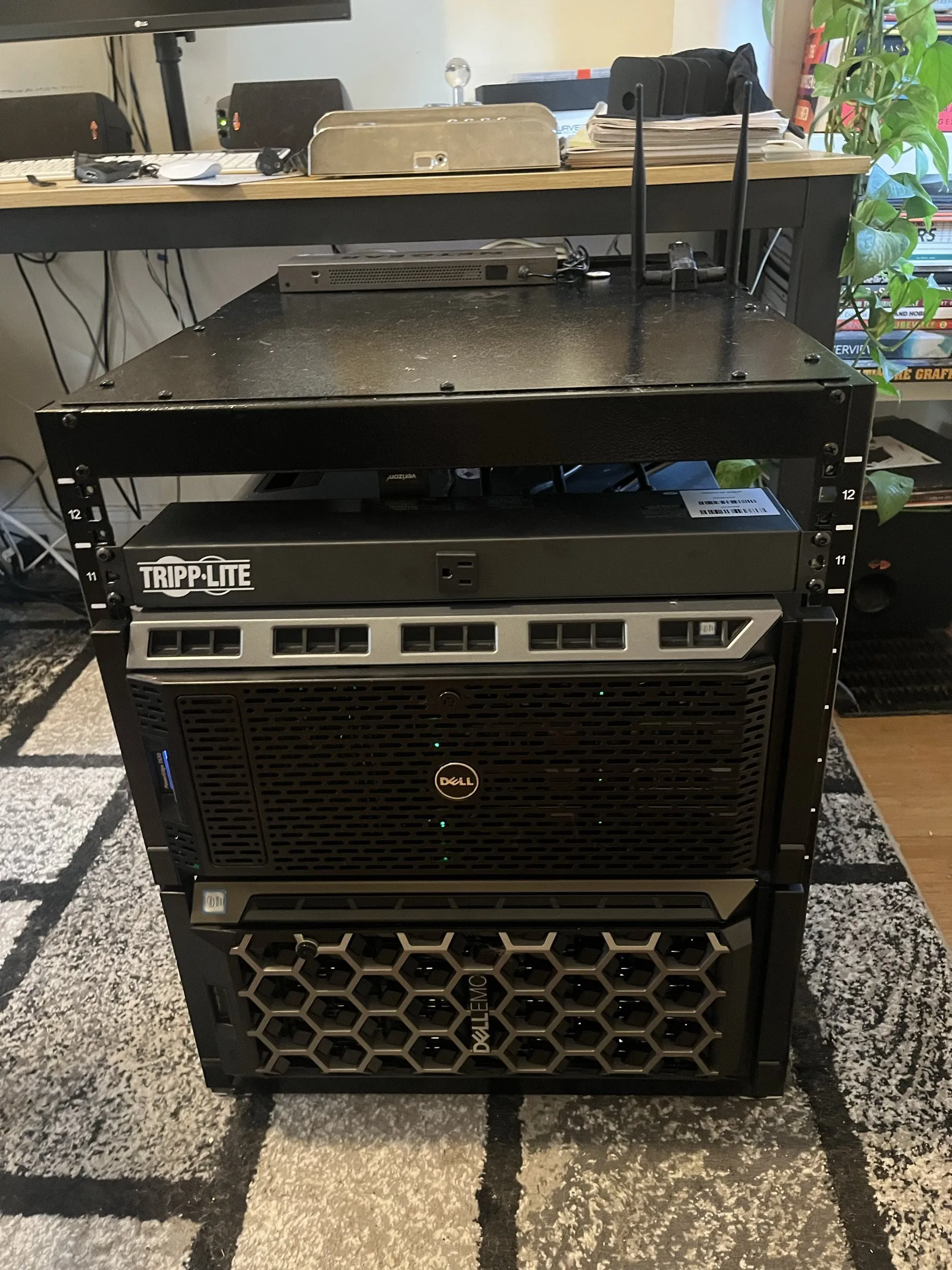 Trogdor and Strongbad, two Dell PowerEdge servers, in a small rack beside a desk